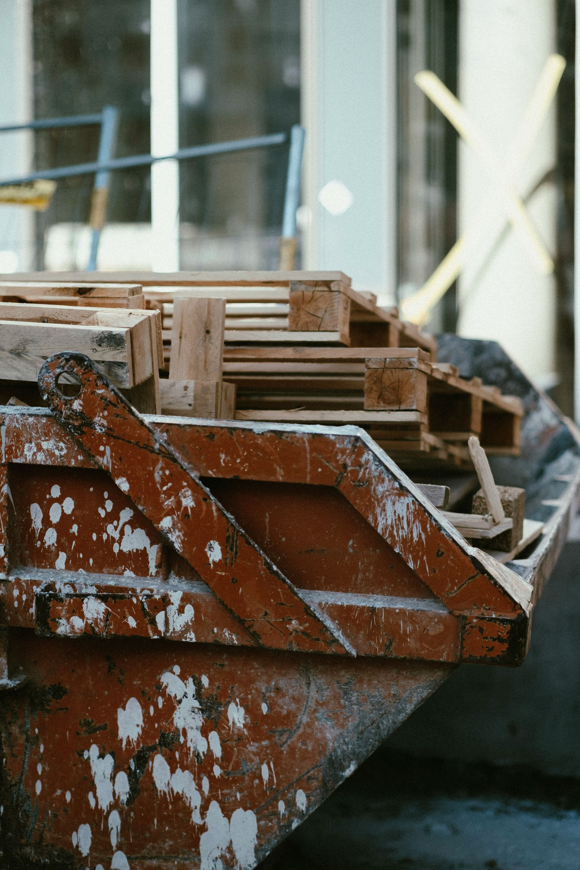 a pile of wooden pallets sitting next to a building