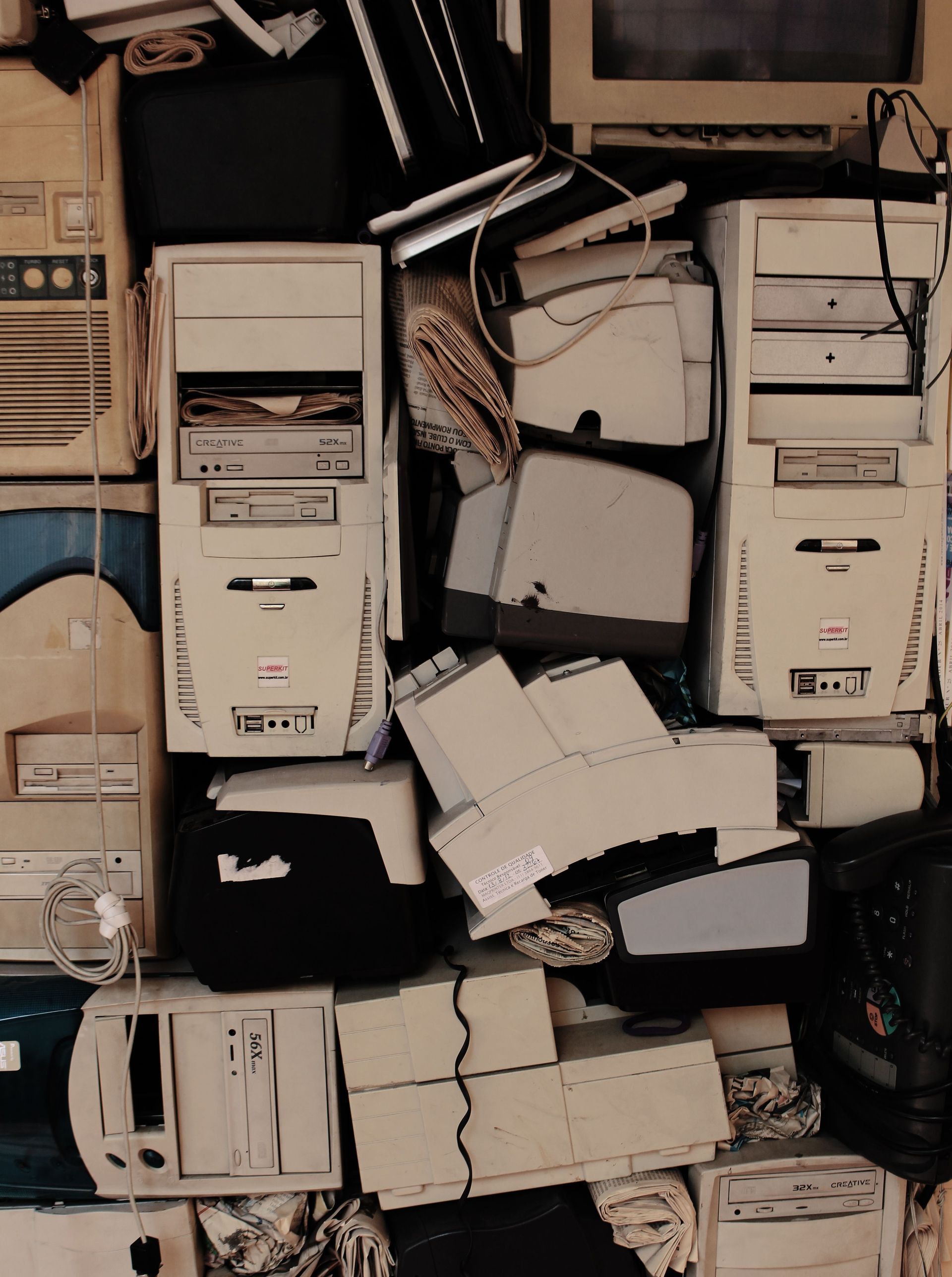 A collection of vintage computer components stacked together, showcasing old technology.